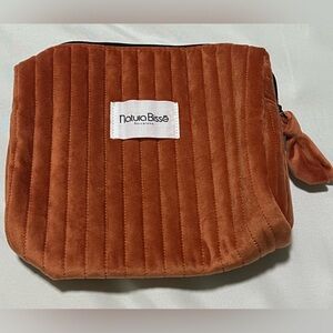 NWOT rust-orange quilted velvet makeup bag: luxury skincare brand Natura Bissé.